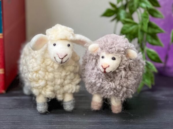 white curly haired needle felted sheep and grey fluffy needle felted sheep